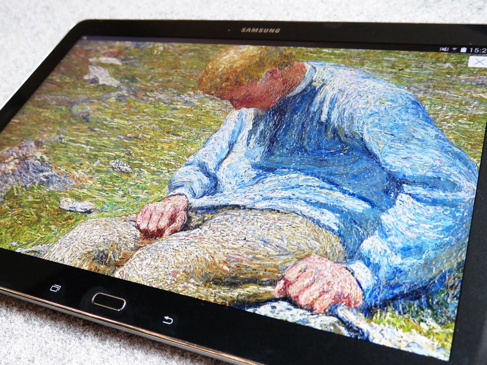 Ein Tablet zeigt ein Gemälde mit einem schlafenden Hirtenjunge.