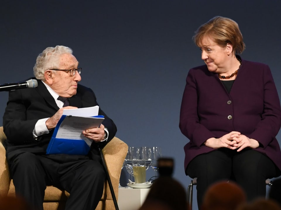 Henry Kissinger und Angela Merkel