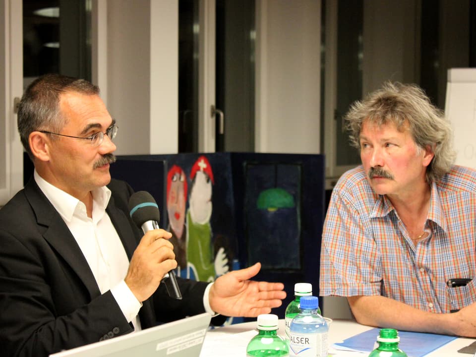Jean-François Steiert und Michael Nüscheler am Diskussionstisch.