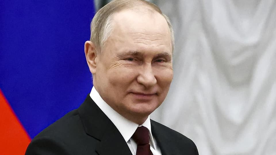 Putin, lächelnd