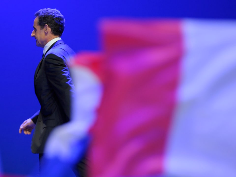 Nicolas Sarkozy, France's incumbent president, leaves the stage after his speech on stage before UMP party supporters after his defeat for re-election in the second round vote of the 2012 French presidential elections at the Mutualite meeting hall in Paris May 6.