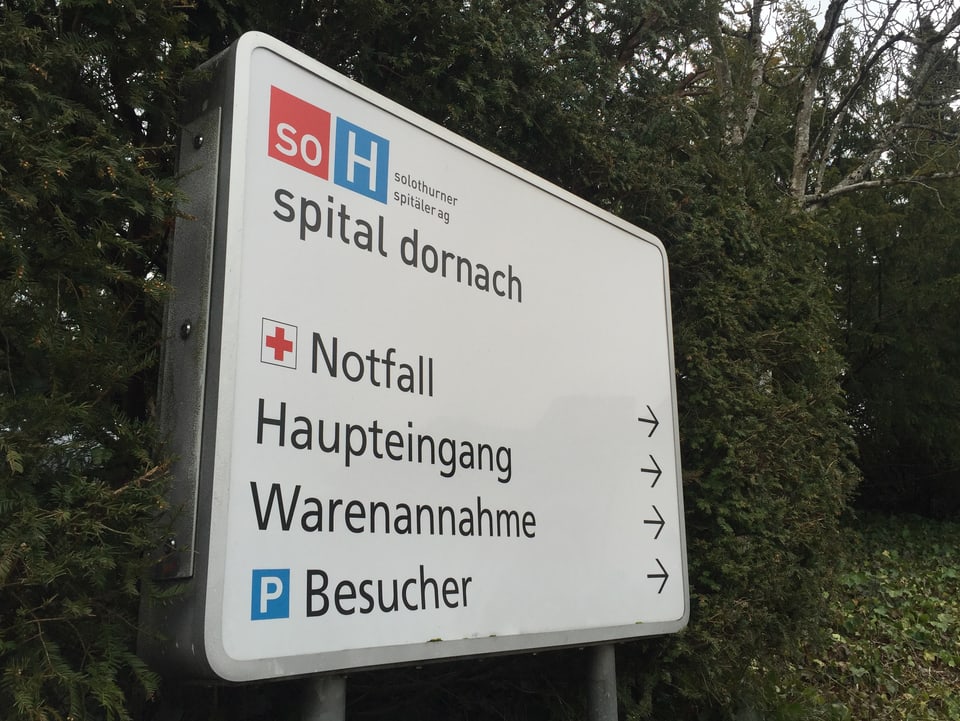 Tafel vor dem Spital Dornach.