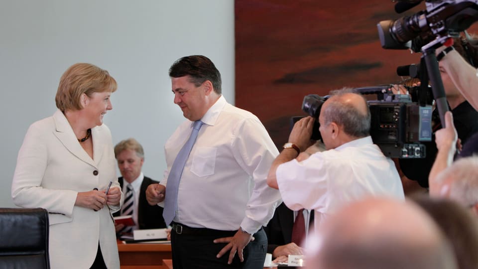 Bundeskanzlerin Angela Merkel und SPD-Parteichef Sigmar Gabriel im Visier der Medien.