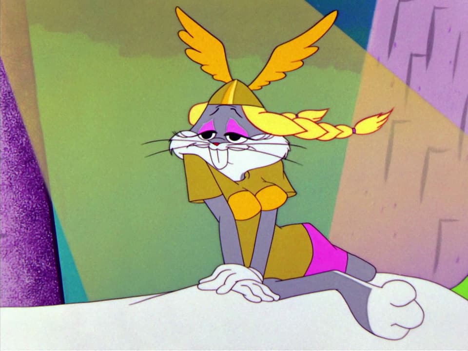 Bugs Bunny, mit Perücke, Helm, Kleid und Brustattrape verkleidet als Brünnhilde.