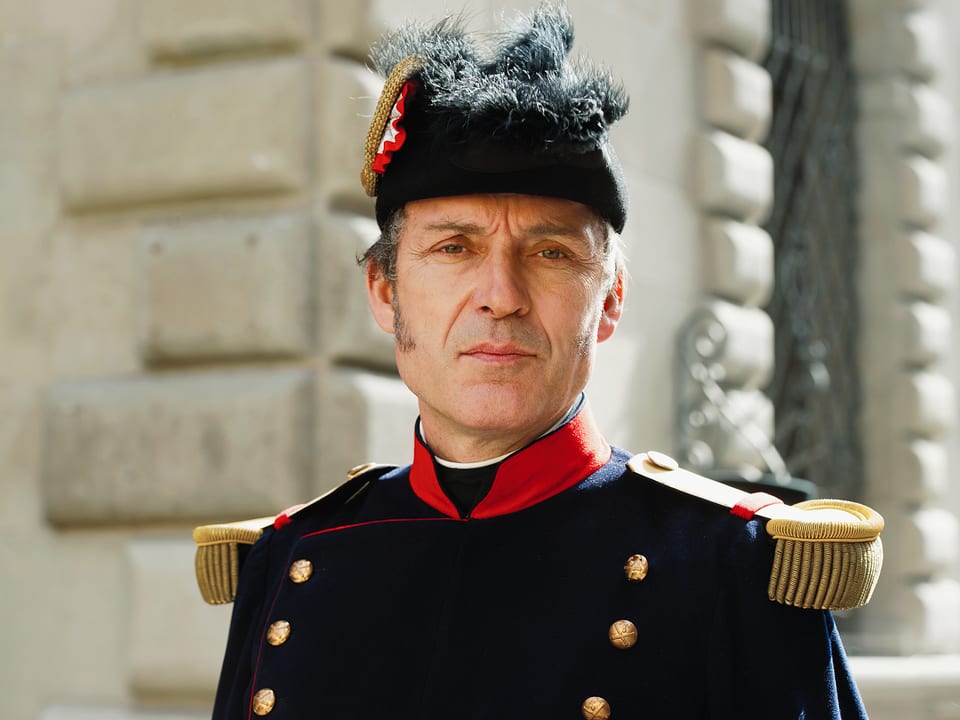 Guillaume Henri Dufour, wichtiger Schweizer General in dunkler Uniform und Hut. 