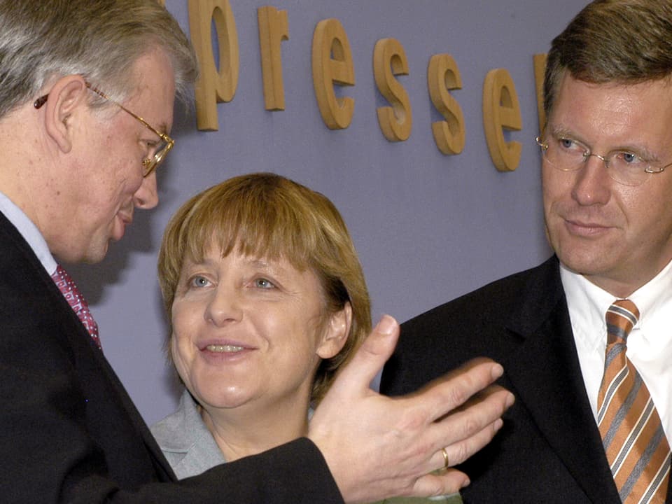 Koch, Merkel und Wulff im Gespräch.