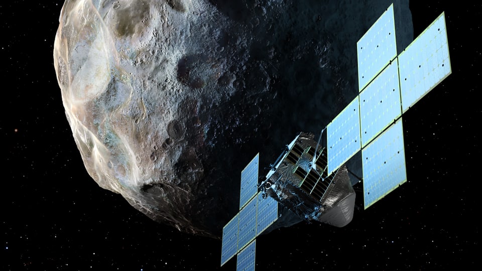 Eine Nasa-Sonde im All vor dem Asteroiden «Psyche»