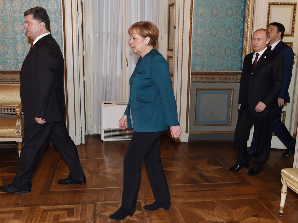 Merkel zwischen Poroschenko und Putin.