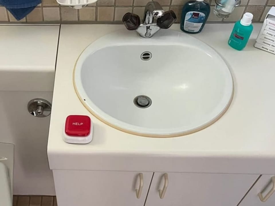 Bathroom, a red box next to the sink.