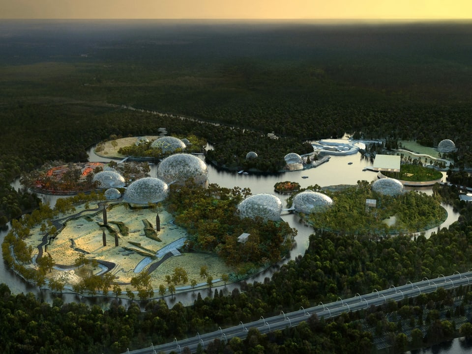 Luftaufnahme von mehreren futuristischen Gebäuden und Seen inmitten von einem Wald.
