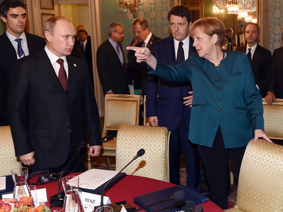 Putin und Merkel in Mailand.