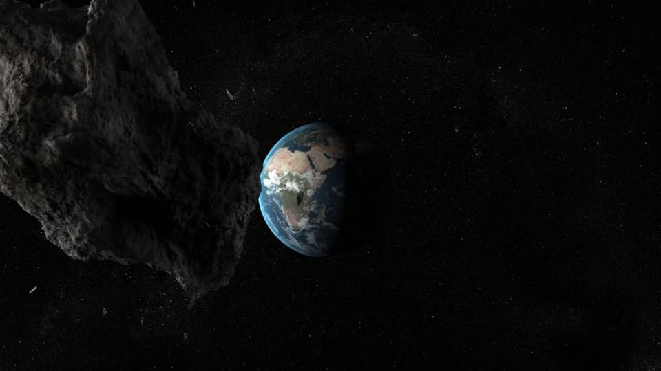 Ein Asteroid fliegt auf die Erde zu. 