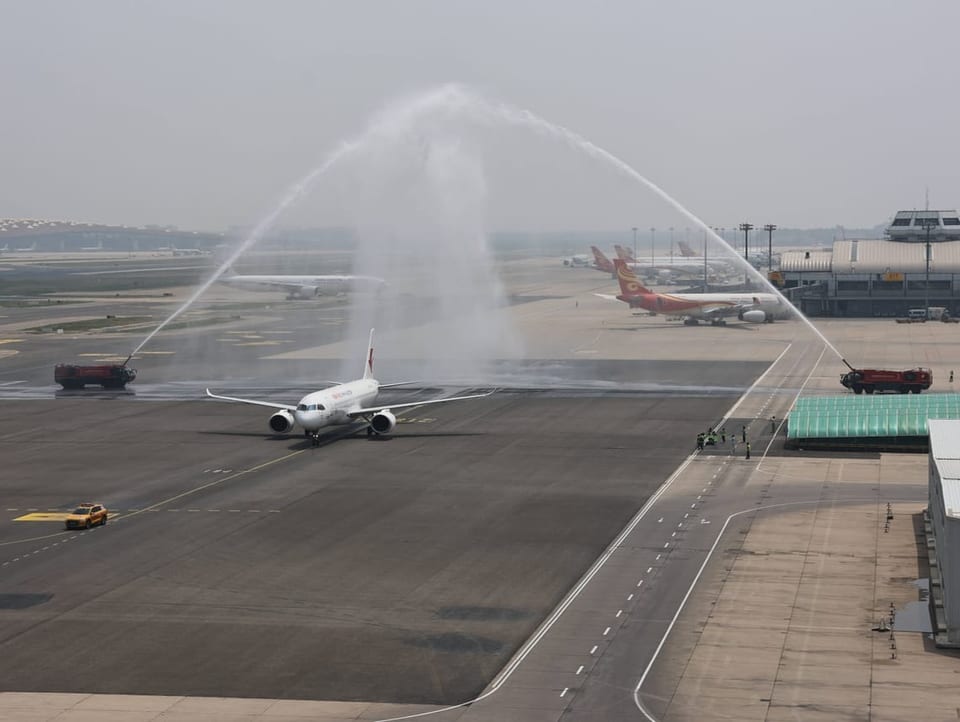 C919 is greeted with water salutes