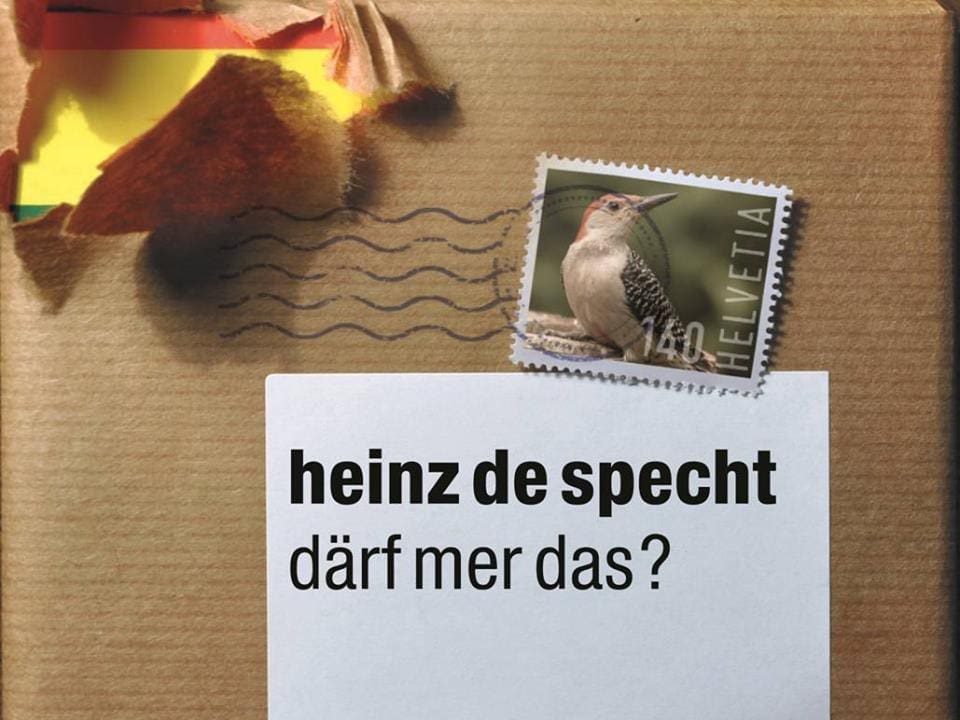 Das neue Cover der Heinz de Specht-CD: eine CD, eingepackt in Päckli-Papier, darunter das alte Logo.