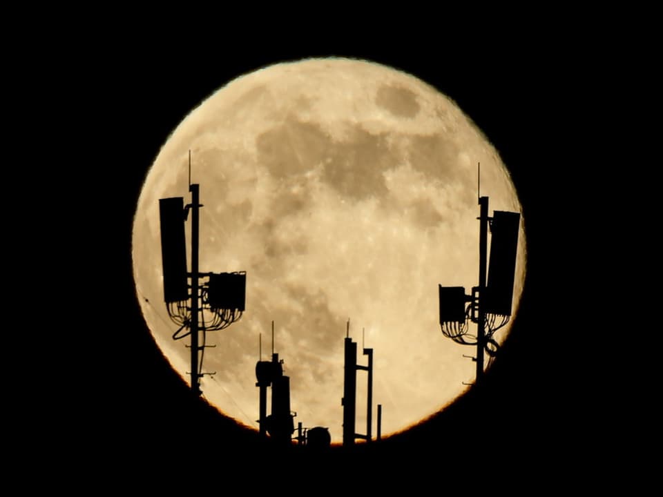 Full moon behind the antennas.