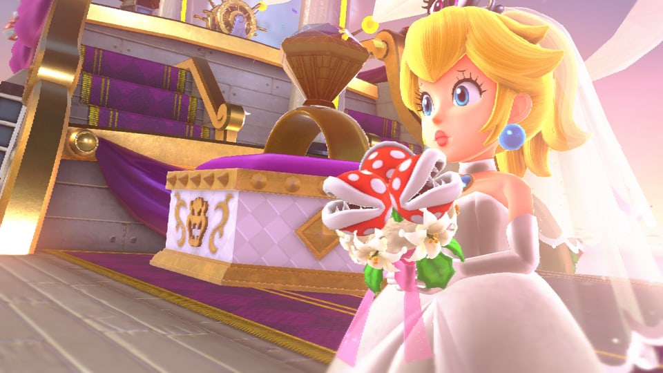 Prinzessin Peach steht schon im Hochzeitskleid bereit auf Bowsers Luft-Schiff.