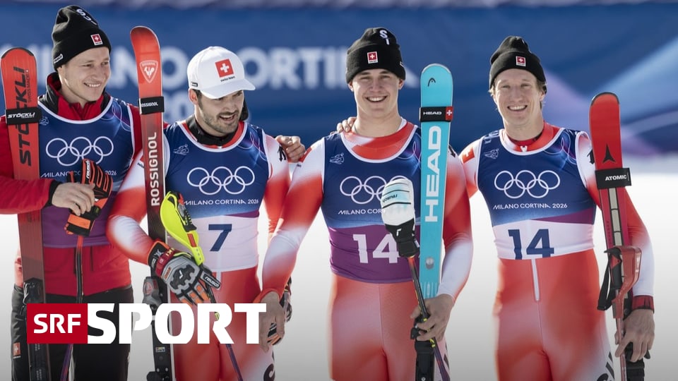Schweiz-holt-Gold-und-Silber-Von-Allmen-Nef-jubeln-in-der-Team-Kombi-vor-Odermatt-Meillard