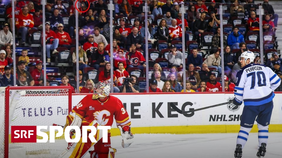 Seltsamer-Matchwinner-in-NHL-Flames-Goalie-Wolf-kann-kuriose-Bogenlampe-nicht-festhalten